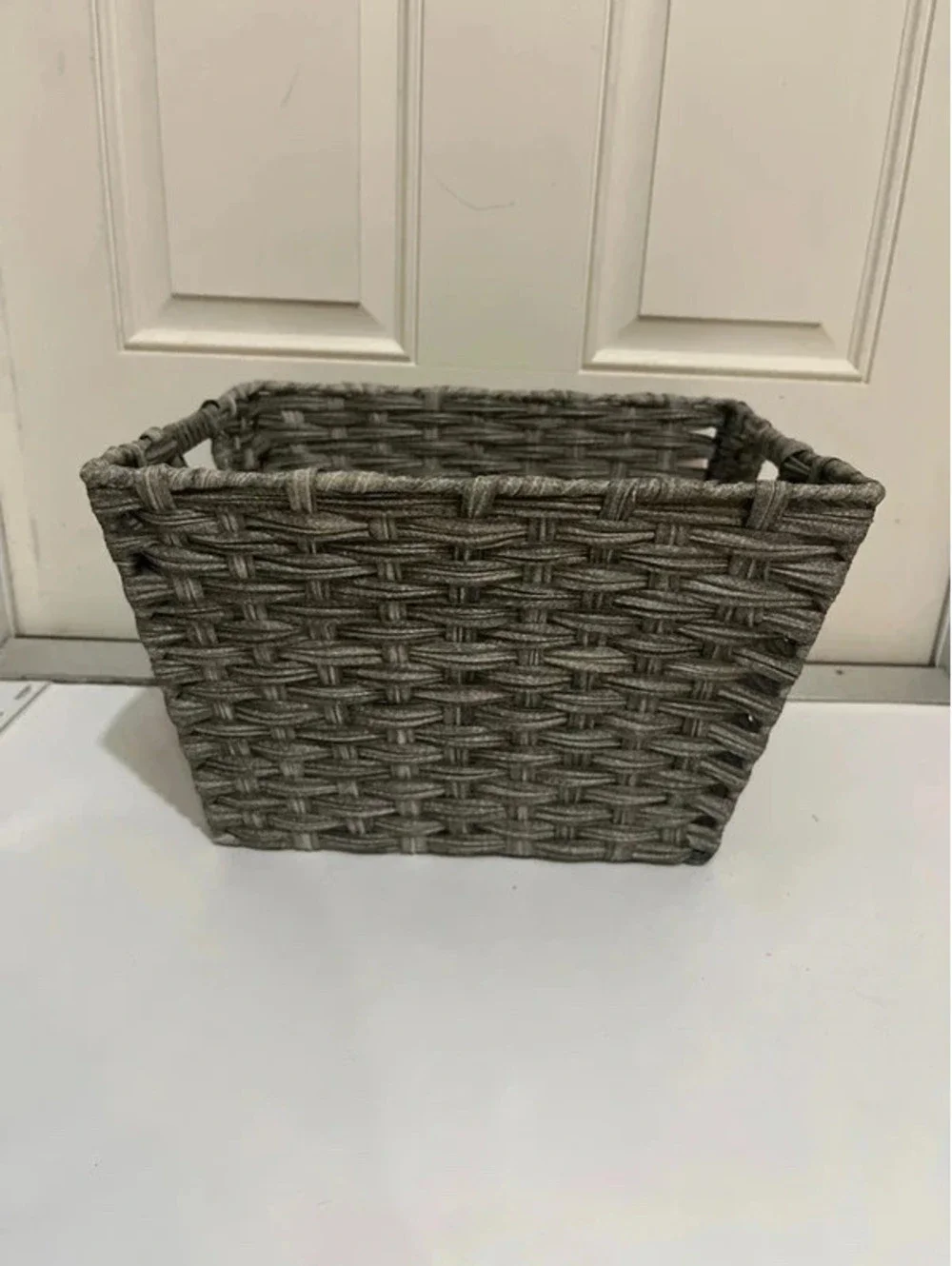 Grey weaved basket for storage organizing
